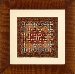 Miniatue quilt in tiger frame